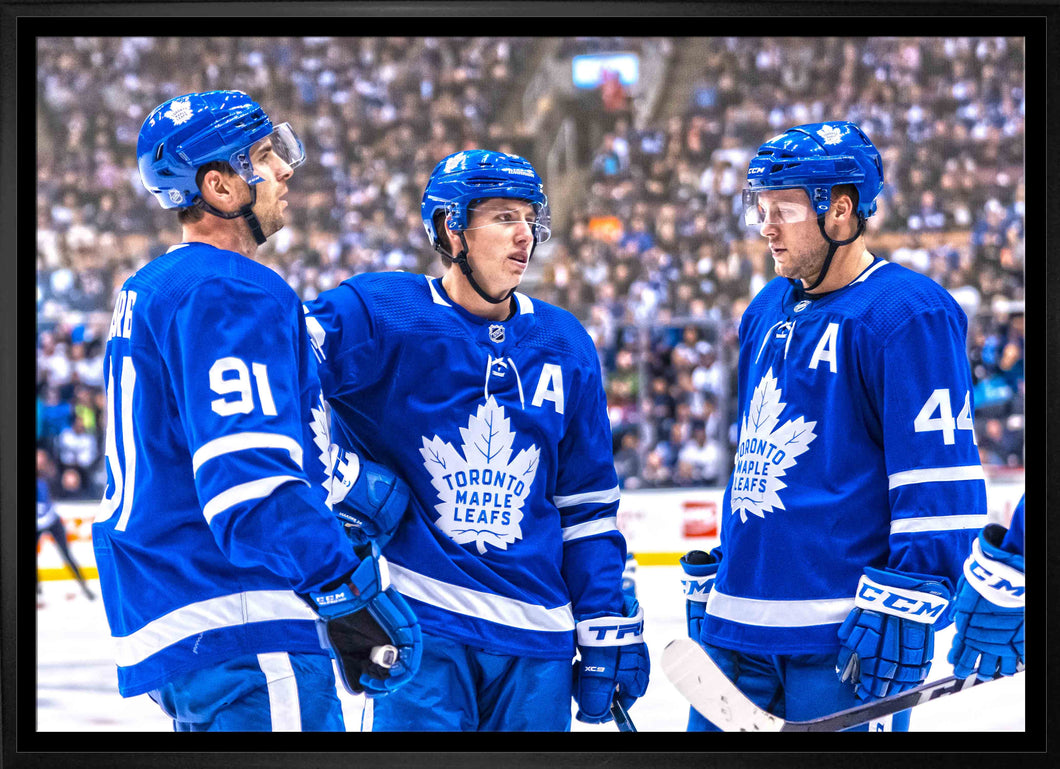 John Tavares, Mitch Marner and Morgan Rielly Toronto Maple Leafs Framed 20x29 Talking on Ice Canvas