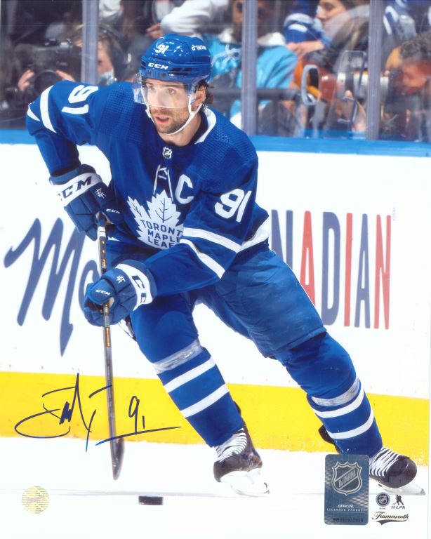 John Tavares Toronto Maple Leafs Signed Unframed 8x10 Skating with the Puck Photo